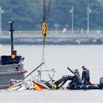 Investigators remove wreckage of the helicopter from the Hudson River